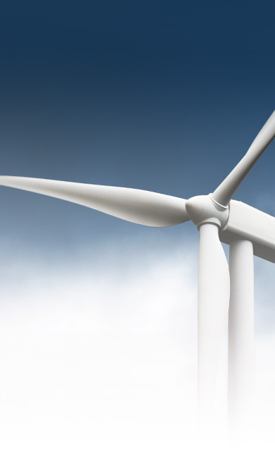 Close up image presenting wind turbine and wind blades in cloudy sky.